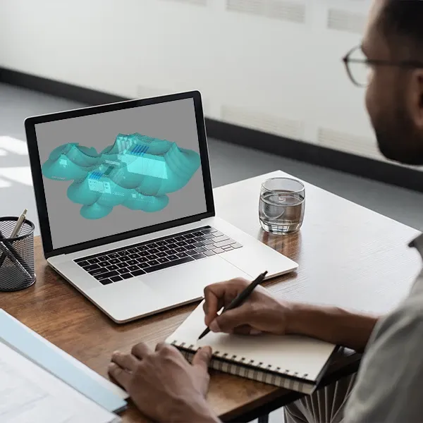 DEHNplan: 3D-Modell am Laptop mit Notizen